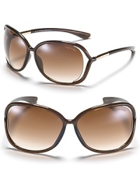 Hit the beach or lounge poolside in Tom Ford's chic oversized sunglasses with open temples. Hit the beach or lounge poolside in Tom Ford's chic oversized sunglasses with open temples.