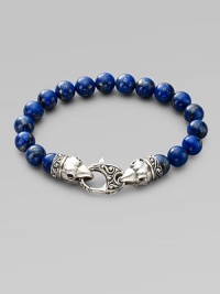 A welcome touch of color, strung with 10mm lapis beads and a raven's head sterling silver clasp. About 9¼ long Imported A welcome touch of color, strung with 10mm lapis beads and a raven's head sterling silver clasp. About 9¼ long Imported