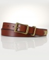 An antiqued brass buckle and decorative ring lend this classic leather belt the feel of a vintage favorite.