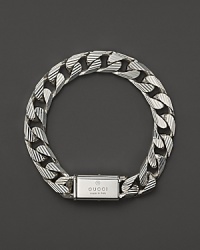Bold trademark stripes add textural beauty to this sterling silver link bracelet from Gucci. Bold trademark stripes add textural beauty to this sterling silver link bracelet from Gucci.