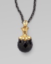 A goldplated sterling silver lion claw, complete wit pavé black cubic zirconia, looms over a jet crystal, strung on a long elegant chain.Jet crystal Cubic zirconia Goldplated sterling silver Black rhodium plated sterling silver Chain length, about 30 Pendant width, about 1½ Lobster clasp Imported