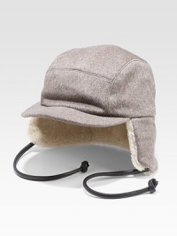 The best answer for a cold, windy day in fine cashmere with shearling lining for ultimate warmth. Leather ties Natural lamb's shearling lining Cashmere Spot clean Fur origin: Portugal Made in USA The best answer for a cold, windy day in fine cashmere with shearling lining for ultimate warmth. Leather ties Natural lamb's shearling lining Cashmere Spot clean Fur origin: Portugal Made in USA