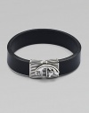 Simply elegant bracelet of smooth leather joined together by a detailed silver clasp.LeatherSilverAbout 3 diam.Lobster claw claspImported