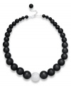 Embolden your look. Matte black agate (520 ct. t.w.) and a textured sterling silver bead make any look pop on this dramatic necklace. Beads strung on a silk cord. Approximate length: 19 inches + 3-inch extender.