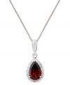 Crimson perfection. A pear-cut garnet (3 ct. t.w.) is the focal point amongst a ring of sparkling diamond accents. Necklace crafted in 14k rose gold. Approximate length: 18 inches. Approximate drop: 1 inch.