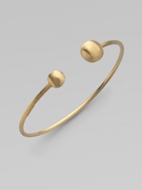 From the Africa Collection. Two 18k yellow gold orbs bookend this open bangle design.18k yellow gold Diameter, about 7 Made in Italy From the Africa Collection. Two 18k yellow gold orbs bookend this open bangle design.18k yellow gold Diameter, about 7 Made in Italy