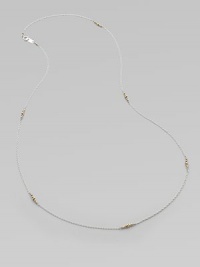 A graceful sterling silver chain, delicately spaced with clusters of tiny, faceted 14k gold beads.14k yellow gold and sterling silverLength, about 26Spring ring claspMade in USA A graceful sterling silver chain, delicately spaced with clusters of tiny, faceted 14k gold beads.14k yellow gold and sterling silverLength, about 26Spring ring claspMade in USA