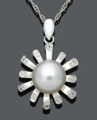 Freshen your look in sweet floral style. This chic pendant features diamond-accented petals, a cultured freshwater pearl center (8-9 mm), and a sterling silver setting. Approximate length: 18 inches. Approximate drop: 7/8 inch. Freshen your look in sweet floral style. This chic pendant features diamond-accented petals, a cultured freshwater pearl center (8-9 mm), and a sterling silver setting. Approximate length: 18 inches. Approximate drop: 7/8 inch.
