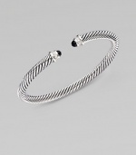 From the Color Classic Collection. A signature Yurman cable of sterling silver, richly enhanced by bands of pavé diamonds, encircling black onyx end caps. Diamonds, 0.09 tcw Black onyx Sterling silver Cable, 5mm Diameter, about 2½ Made in USA