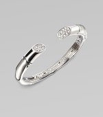 A sizable cuff accented with white sapphires adorned ends. White sapphires Sterling silver Kick mechanism closure Diameter, about 2¼ Imported 