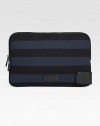 Striped neoprene zips around your laptop for a stylish, protective cover.Zip closureNeoprene13W x 8HImported