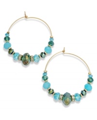Boho-chic comes full circle. These darling c.A.K.e. by Ali Khan hoop earrings feature turquoise color glass beads and crystal accents. Approximate diameter: 2-3/4 inches. Boho-chic comes full circle. These darling c.A.K.e. by Ali Khan hoop earrings feature turquoise color glass beads and crystal accents. Approximate diameter: 2-3/4 inches.
