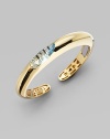 EXCLUSIVELY AT SAKS. A rounded, slim piece with an oval center stone. 18k gold Topaz Slip-on style Length, about 7 Made in Italy 