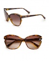 Feminine frames with a modern, notched side detail. Available in havana with brown gradient lens or blue with grey gradient lens. Logo temples100% UV protectionMade in Italy 