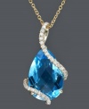 Wrap up your look in a stylish, blue hue. Effy Collection pendant features a pear-cut blue topaz (5-7/8 ct. t.w.) cradled in swirls of round-cut diamonds (1/6 ct. t.w.). Chain and setting crafted in 14k gold. Approximate length: 18 inches. Approximate drop width: 1/2 inch. Approximate drop length: 1 inch.