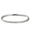 This slender princess-cut tennis bracelet sparkles with fine cubic zirconia. Five petite stones adorn the clasp.