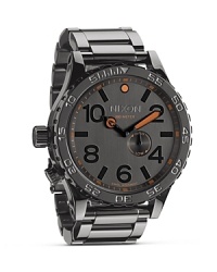 Designed for high-impact performance and style, this boldly sized watch from Nixon features 300-meter water resistance, an easy to read dial, and sturdy bracelet. Designed for high-impact performance and style, this boldly sized watch from Nixon features 300-meter water resistance, an easy to read dial, and sturdy bracelet.