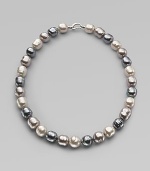 A soft melange of grey, nuage and white baroque man-made pearls creates drama at the neck. 14mm multicolor organic baroque pearls Length, about 20 Sterling silver spring clip clasp Made in Spain