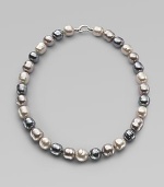 A soft melange of grey, nuage and white baroque man-made pearls creates drama at the neck. 14mm multicolor organic baroque pearls Length, about 20 Sterling silver spring clip clasp Made in Spain