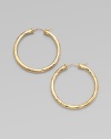 From the Martellato Collection. Graceful hoops with a rich hammered texture in gleaming 18k gold.18k yellow goldDiameter, about 1¾PiercedMade in Italy