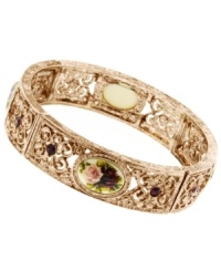 A cameo appearance. Amethyst-colored resin beads and a pretty floral charm accent 2028's unique vintage bracelet. Set in rose gold tone mixed metal. Bracelet stretches to fit wrist. Approximate diameter: 2-1/4 inches. A cameo appearance. Amethyst-colored resin beads and a pretty floral charm accent 2028's unique vintage bracelet. Set in rose gold tone mixed metal. Bracelet stretches to fit wrist. Approximate diameter: 2-1/4 inches.