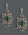Another truly dazzling design from Effy Collection, these gorgeous drop earrings highlight emerald-cut emeralds (1 ct. t.w.) surrounded by intricate cut-outs accented with round-cut diamonds (1/2 ct. t.w.). Set in 14k gold with a post backing. Approximate drop length: 1-2/5 inches. Approximate drop width: 2/3 inch.