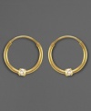 Put a sparkle in your favorite little girl's eye with these earrings. Round-cut cubic zirconia accents are set in 14k gold (12 mm).