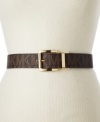 Inspired by the sophistication of classic luggage, this wide logo belt by MICHAEL Michael Kors features gleaming hardware.