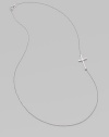 A wispy chain of 14k white gold features a cross pendant set askew for a modern edge.14k white gold Length, about 16 Pendant length, about ¾ Spring ring clasp Made in USA