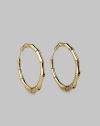 Bold bamboo-textured hoops, exquisitely crafted of gleaming 18k yellow gold. 18k yellow gold Diameter, about 2¼ Pierced Made in Italy