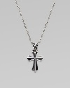 A rayskin-textured cross, crafted in sterling silver with contrasting onyx inlay. Sterling silver Onyx Pendant, about 2 long Necklace, about 20 long Imported 