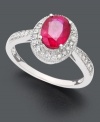 A pink-tinged ruby takes center stage on this heartwarming ring. Oval-cut ruby (1-1/2 ct. t.w.) in 14k white gold setting encrusted with round-cut diamond (1/4 ct. t.w.).