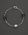 A bold sterling silver chain bracelet, gleaming with amethyst and freshwater pearl. By Di MODOLO.