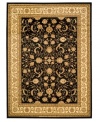 Dazzling mystery. Capturing the intricacies of ancient Persian designs, the Lyndhurst area rug presents an updated version in gorgeous ivory over a black ground. Made with durable polypropylene in a soft, low pile for the modern home.