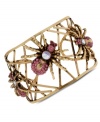 Fashion with legs. Betsey Johnson's cuff bracelet weaves a stylish web with pink and clear crystal-accented spiders. Crafted in antiqued gold tone mixed metal. Approximate diameter: 2-3/8 inches.