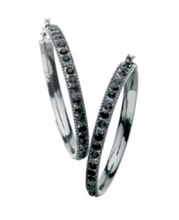 Get easy, glamorous style in glittering hoops by GUESS. Earrings feature rows of round-cut jet crystals set in hematite tone mixed metal. Approximate diameter: 1-1/2 inches. Get easy, glamorous style in glittering hoops by GUESS. Earrings feature rows of round-cut jet crystals set in hematite tone mixed metal. Approximate diameter: 1-1/2 inches.