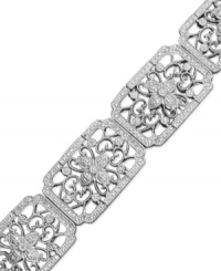 Dainty and delicate, this bracelet will dazzle you with its intricate filigree design. Set in sterling silver, this cuff-style bracelet is covered with sparkling diamonds (1-1/2 ct. t.w.). Approximate diameter: 3 inches. Approximate length: 7-1/2 inches.