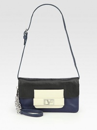 A luxurious leather style in a colorblocked design with detachable wristlet and shoulder strap.Detachable leather and chain wristlet strap, 7 dropDetachable adjustable shoulder strap, 8-10 dropSnap button flap closureThree inner compartmentsOne inside zip pocketOne inside open pocketFully lined8¼W X 4½H X 1DImported A luxurious leather style in a colorblocked design with detachable wristlet and shoulder strap.Detachable leather and chain wristlet strap, 7 dropDetachable adjustable shoulder strap, 8-10 dropSnap button flap closureThree inner compartmentsOne inside zip pocketOne inside open pocketFully lined8¼W X 4½H X 1DImported