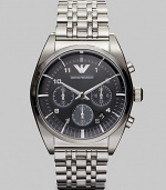 Sleek and shiny stainless steel bracelet is accented with a textured dial with chronograph functionality.Round bezelQuartz movementWater resistant to 5ATMDate function at 4Stainless steel case: 43mm (1.69)Stainless steel braceletSecond handImported