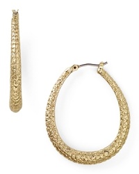 Tap into this season's textured trend with this pair of gold-plated hoop earrings from Carolee, accented by subtle, snakeskin-effect detailing. Tap into this season's textured trend with this pair of gold-plated hoop earrings from Carolee, accented by subtle, snakeskin-effect detailing.