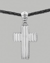 A ridged cross pendant crafted in polished silver hangs from a woven cord of soft leather. From the Bedeg Collection Silver Leather Pendant, 1W X 2¼H Necklace, adjustable 26-28 Lobster clasp Imported 