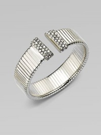 An elegantly ribbed, flexible cuff with Swarovski crystal caps.CrystalSilverplatedDiameter, about 2¼Made in Italy An elegantly ribbed, flexible cuff with Swarovski crystal caps.CrystalSilverplatedDiameter, about 2¼Made in Italy