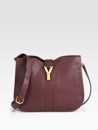 Luxurious sheepskin leather accented with signature hardware.Adjustable shoulder strap, 19¾-22 dropMagnetic flap snap closureThree inner compartmentsOne inside zip pocketCotton lining12W X 9½H X 2½DMade in Italy Luxurious sheepskin leather accented with signature hardware.Adjustable shoulder strap, 19¾-22 dropMagnetic flap snap closureThree inner compartmentsOne inside zip pocketCotton lining12W X 9½H X 2½DMade in Italy