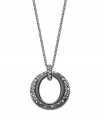 The name speaks for itself. You'll be stunned by Eliot Danori's Star Struck Circle Pendant. A cut-out circle shines with the addition of sparkling crystals. Crafted in anthracite tone mixed metal. Approximate length: 36 inches. Approximate drop: 1-1/2 inches.