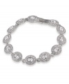 Inspire yourself in glamorous style. Carolee bracelet features oval-cut glass stones linked together in a silver tone mixed metal setting. Approximate length: 7 inches.