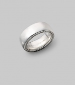 A classic sterling silver ring, with cable detail on the sides. About ½ wide Imported