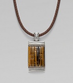 A stunning dogtag pendant is designed in fine silver with basketwoven tiger's eye and quartz detail on a leather cord necklace. From the Bedeg Collection Silver Tiger's eye Quartz, 0.56 tcw Leather Pendant, 1W X 2¼H Necklace, adjustable 18-20 Lobster clasp Imported 