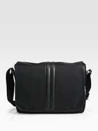 The perfect piece for the man on the go, a stylish nylon messenger with smart leather details.Magnetic flap closureAdjustable shoulder strapExterior zip-front pocketExterior back flap pocketInterior pocketsNylon; leather trim16W X 11H X 3DMade in Italy The perfect piece for the man on the go, a stylish nylon messenger with smart leather details.Magnetic flap closureAdjustable shoulder strapExterior zip-front pocketExterior back flap pocketInterior pocketsNylon; leather trim16W X 11H X 3DMade in Italy