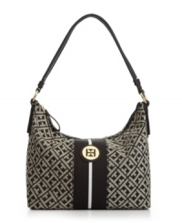 Express your signature style in classic Tommy Hilfiger fashion with this logo detailed design. With a sleek striped center and shiny goldtone hardware this easy-going hobo is almost impossible to resist. Express your signature style in classic Tommy Hilfiger fashion with this logo detailed design. With a sleek striped center and shiny goldtone hardware this easy-going hobo is almost impossible to resist.