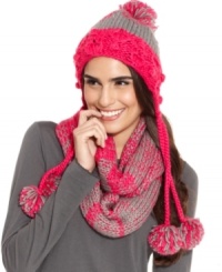 Cozy comfort accented with playful pom poms. Beat the chill in colorful style with this care-free knit cap by American Rag. Cozy comfort accented with playful pom poms. Beat the chill in colorful style with this care-free knit cap by American Rag.